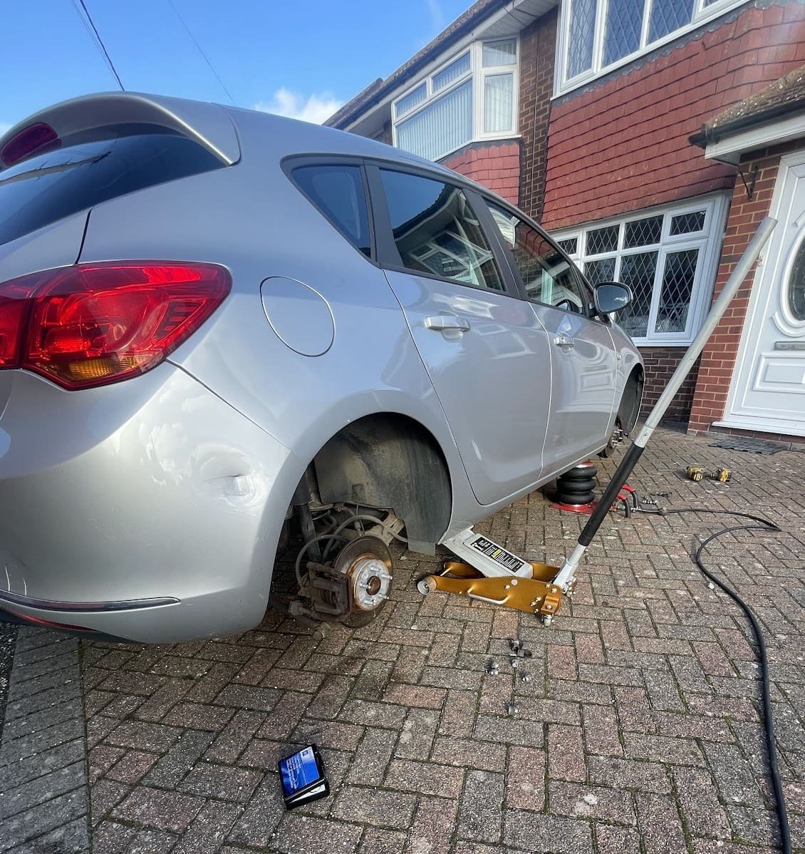 Mobile tyre fitting van parked on a customer's driveway